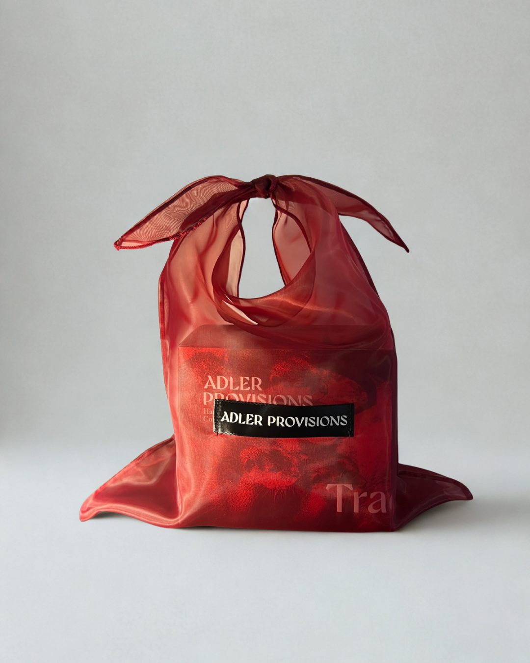 Adler Provisions gift box in its signature red organza bag